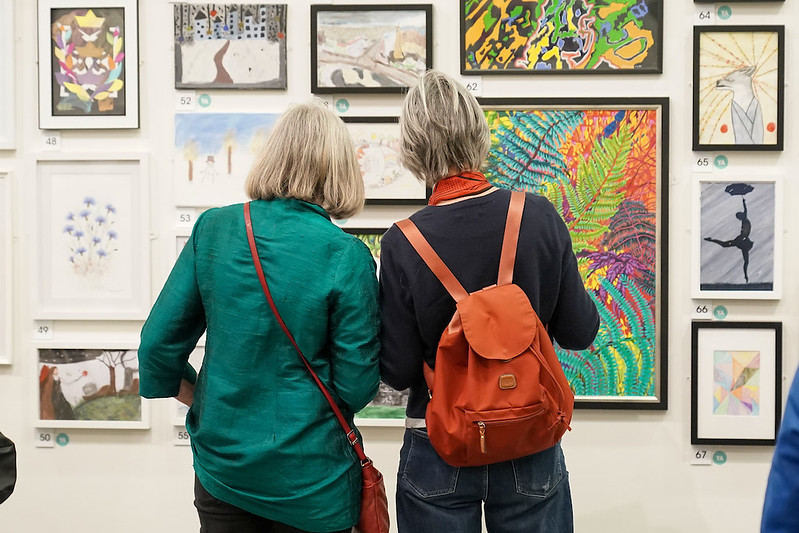 Visitors look at the art on display at Kirkby Gallery